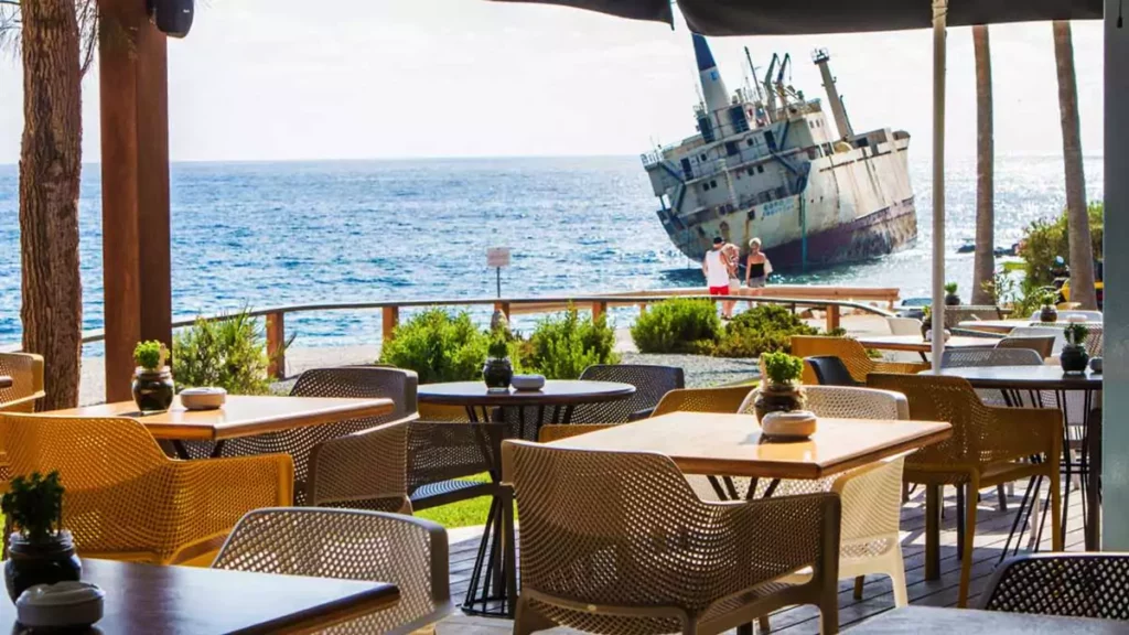 Exterior view of Oniro by the Sea restaurant in Peyia, Cyprus, showing its seaside setting.