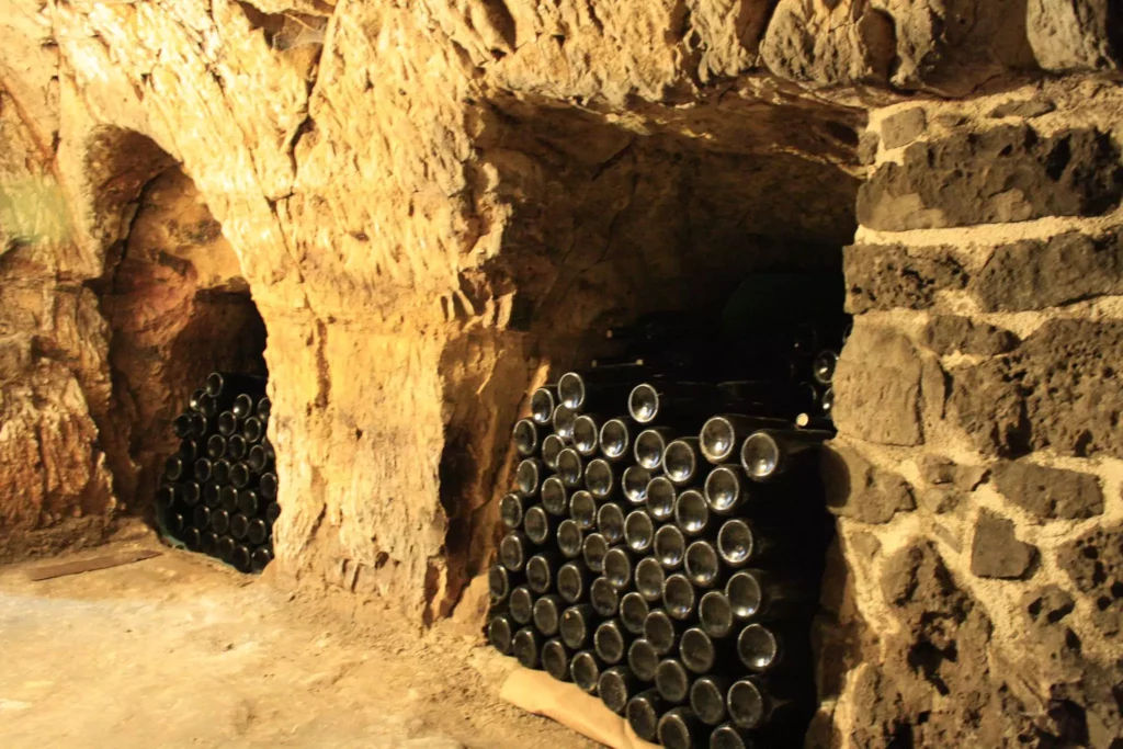 Close-up of wine stored in the underground caves at Sterna Winery, emphasizing the winery's artisanal craftsmanship.