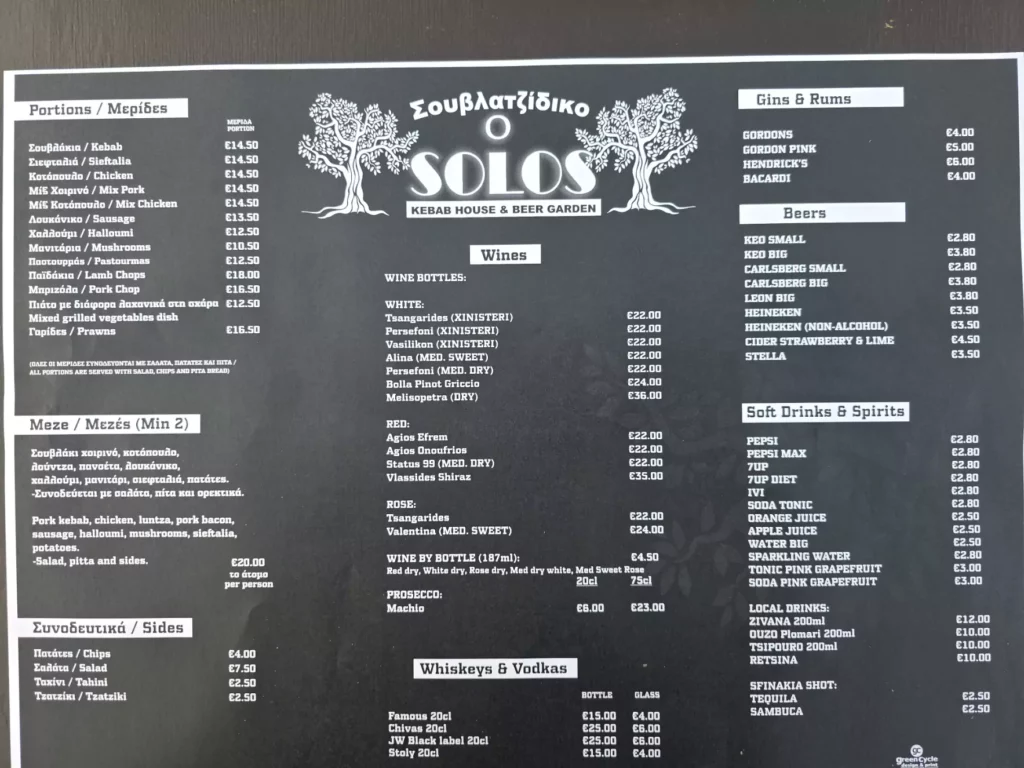 A menu displayed at Solos - Kebab House & Beer Garden, showing various kebab plates, sides, and drinks.