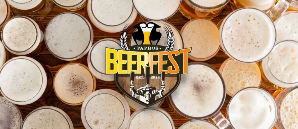 Variety of craft beers displayed at the Paphos Beer Festival, featuring colorful labels and unique brewing styles.