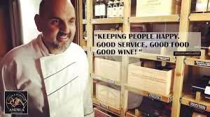 Photo of the owners of Andria's Steak and Seafood restaurant interacting with guests, ensuring high quality and excellent service.