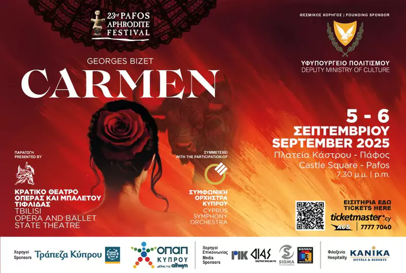 Advertising poster for Carmen at the Pafos Aphrodite Festival featuring a dramatic close-up of a soprano in a red dress, with flames motif and the festival logo